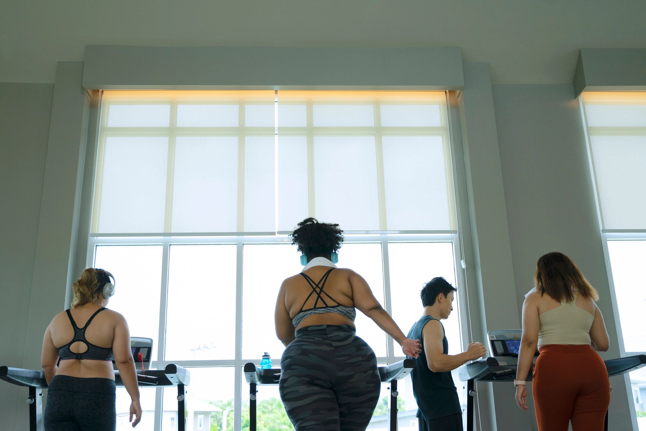 Women arriving for a workout in a stylish boutique fitness setting