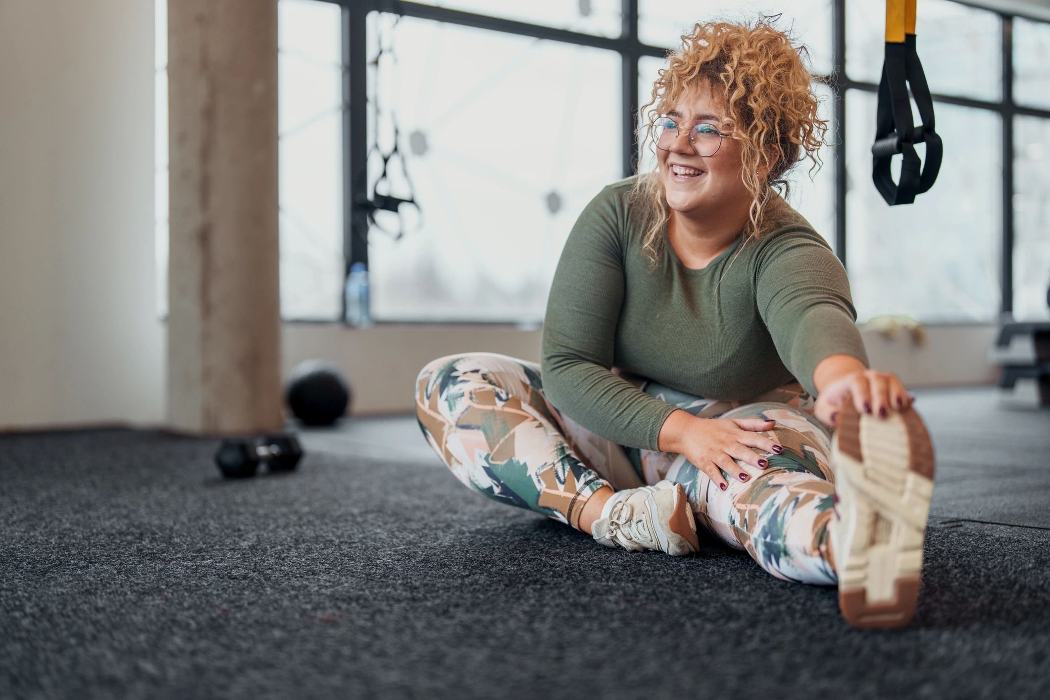 Client stretching during a focused studio workout